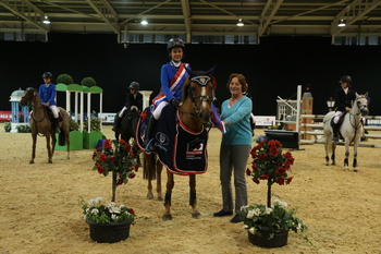 Hannah Barker riding Ballybur Oh Jessie win the National 128cm Championship Final